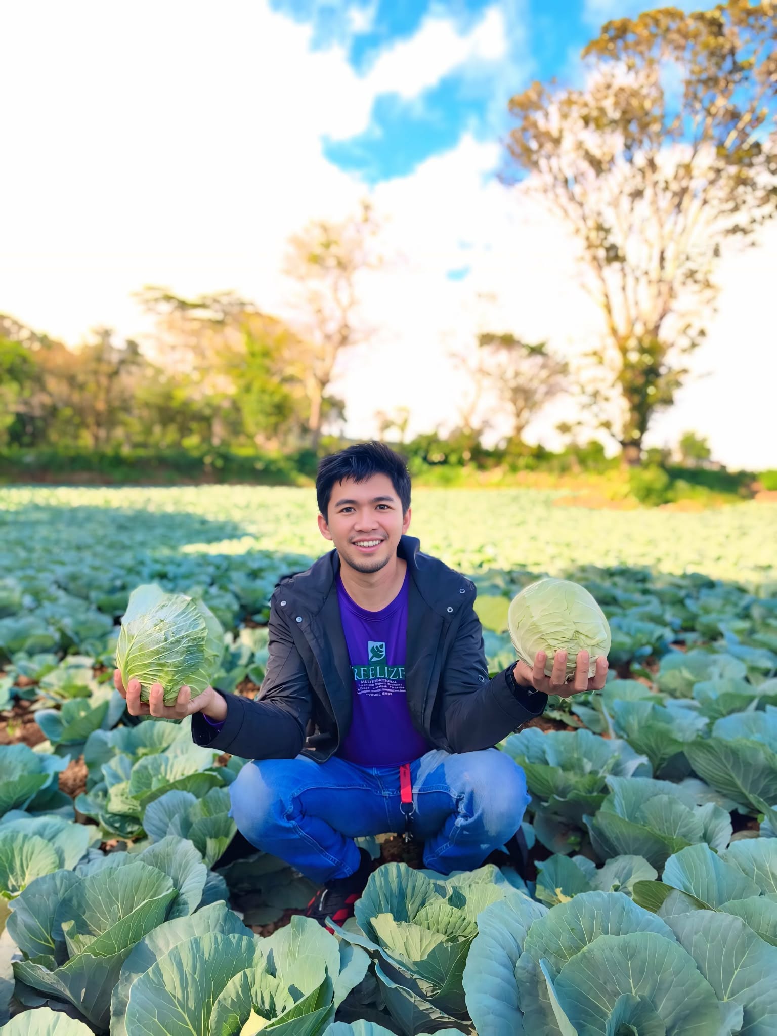 A worker applying product in a vegetable field